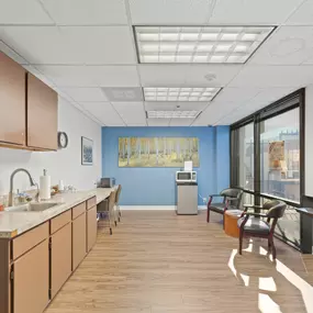 Spencer Street Self Storage office interior featuring comfortable customer reception area, refreshment station, and professional business environment. Our well-maintained office provides a welcoming space for new customers to learn about storage options and complete rental agreements.