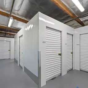 Spencer Street Self Storage interior climate-controlled units featuring freestanding storage compartments with secure roll-up doors. Our specialized interior units offer additional security and protection within our well-maintained, temperature-regulated facility.