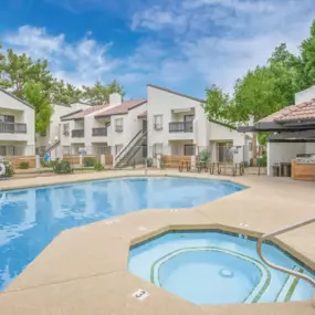 outdoor pool with hot tub and cabana