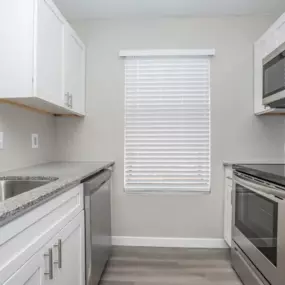 apartment kitchen, with sink, microwave and stove