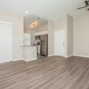 apartment living room with hardwood floors and ceiling fan