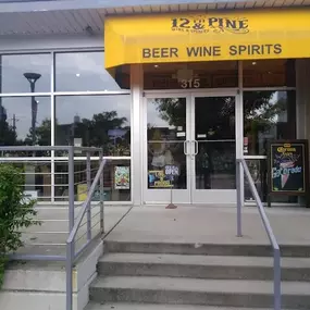 Exterior of 12th & Pine Wine & Spirits — a locally owned liquor store in downtown Nashville, TN. Conveniently located near Broadway, we offer beer, wine, spirits, and cigars with easy access and friendly service.