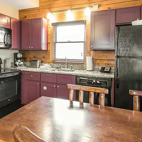 The dining area of an accommodation at Christmas Mountain Campground