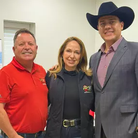 Houston roofing consultation with company leaders and a satisfied customer at our headquarters.