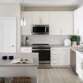 Camden Clearwater apartments have open concept kitchens with modern interior finishes