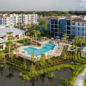 Aerial view of Camden Clearwater apartments, clubhouse, pool and lake.