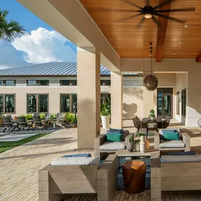 Camden Clearwater apartments outdoor resident lounge with outdoor seating and firepit