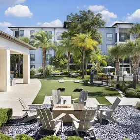 Camden Clearwater apartments in clearwater, fl outdoor resident lounge with firepit and hammock lounge
