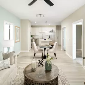 Open-concept living, dining, and kitchen at Camden Clearwater apartments in Clearwater. FL