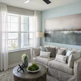 Living room with private balcony at Camden Clearwater apartments in Clearwater, FL