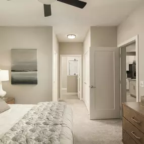Bedroom with ensuite bath and ceiling fan at Camden Clearwater apartments in Clearwater, FL