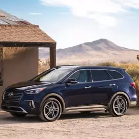 Side profile of the Hyundai Santa Fe in a desert setting