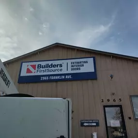 Front of a Builders FirstSource building at 2965 Franklin Ave. displaying a large sign for 