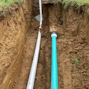 New underground sewer (and downspout redirection line)
