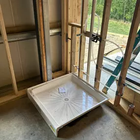 Shower Pans are installed on the Rough In Phase