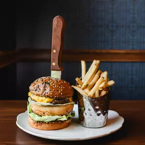 2/3 pound steak burger, cheddar and Swiss Cheese, mayo, lettuce, served with French fries at Dawn Manor