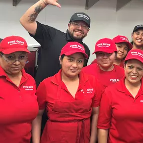 Crew members pose for a photograph ahead of the opening of the Five Guys cloud kitchen at 90 Charter Oak in San Francisco, California.