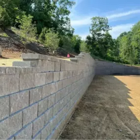 Retaining Wall Construction
When your property needs structure, stability, and erosion control, a well-built retaining wall makes all the difference. At AJ&J Excavation, we specialize in constructing durable, engineered retaining walls that are as functional as they are long-lasting. Whether you're holding back a slope, creating usable yard space, or protecting a foundation, we tailor each wall to the unique demands of your property’s grade, soil type, and drainage. Our team uses quality materia