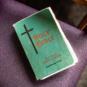 A well-loved Bible sits open on the desk, central to the mission of Wonderfully Made.