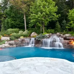 swimming pool with custom nature background and waterfalls