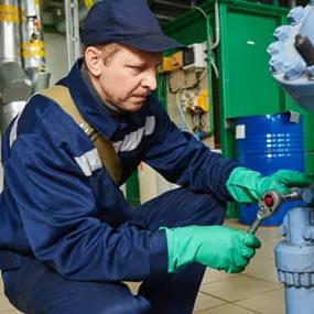 Technician working on a compressor