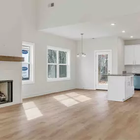 A modern farmhouse blends rustic charm with contemporary style, featuring clean lines, gabled roofs, and a mix of wood, metal, and neutral tones. Open floor plans, large windows, and cozy, functional spaces create a warm yet stylish aesthetic.