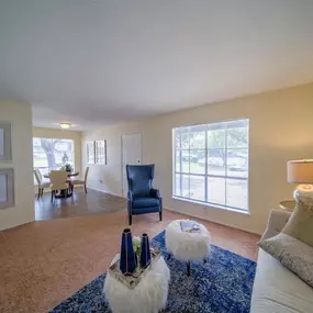 A living room with a couch and a table