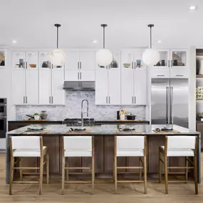 Stunning kitchen with breakfast bar, ample cabinet, and countertop space