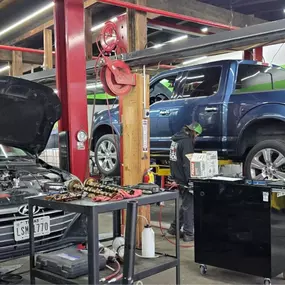 East End Automotive in Oak Ridge, TN shop interior. Your 5-Star Local Mechanic. Multiple vehicles in the shop being repaired.