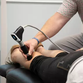 Dr. Zuidema treating a patient with shockwave therapy
