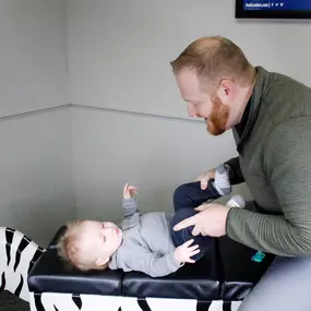 Dr. Lance Zuidema adjusting a child