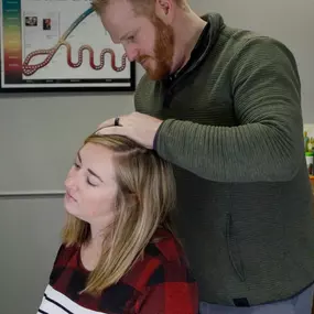 Dr. Lance Zuidema doing upper cervical adjustment