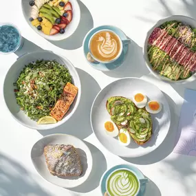 Fresh and healthy table spread featuring vibrant salads,
nutritious bowls, all-day breakfast favorites, specialty coffees,
matcha lattes and teas.