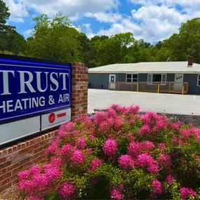 The Trust Heating and Air headquarters stands as a central hub for reliable HVAC and refrigeration services in Northeast Georgia. Featuring branded vehicles, professional signage, and a clean, organized facility, the image reflects the company’s commitment to quality, professionalism, and community presence. As the base of operations for residential and commercial heating, air conditioning, and walk-in refrigeration services, Trust’s headquarters represents their dedication to fast service, expe