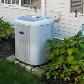 A compact outdoor air conditioning unit is installed next to a home or small building, designed to provide efficient cooling in tight or limited spaces. The unit features clean lines, a visible fan grill, and durable housing, ideal for residential use, apartments, or small offices. This image highlights space-saving HVAC solutions, energy-efficient cooling, and the importance of professional installation for dependable summer comfort.