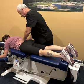 Dr. R. Todd Kirstein adjusting a patient's back