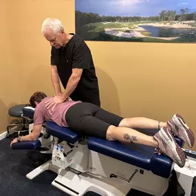 Dr. R. Todd Kirstein adjusting a patient's back