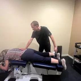 Dr. Gage Kirstein adjusting a patient