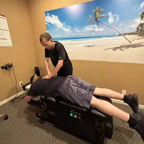 Dr. Gage Kirstein adjusting a patient