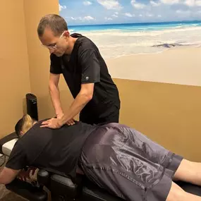 Dr. Gage Kirstein adjusting a patient