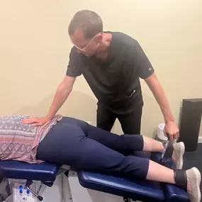 Dr. Gage Kirstein adjusting a patient