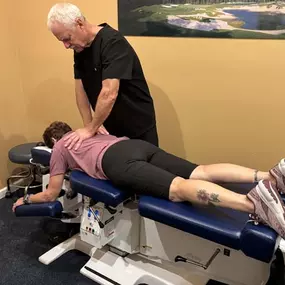 Dr. R. Todd Kirstein adjusting a patient's back