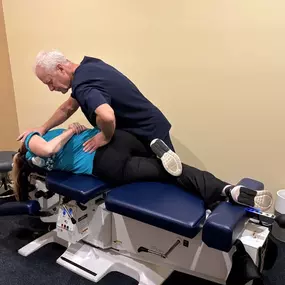 Dr. R. Todd Kirstein adjusting a patient's back