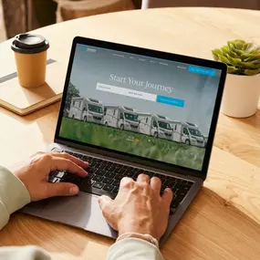 An image of the Highwood Motorhomes website displayed on a laptop