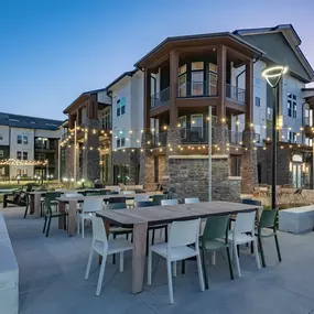 A patio with a seating area