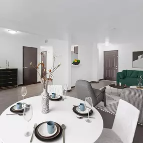 A living room and dining room with a white table and chairs