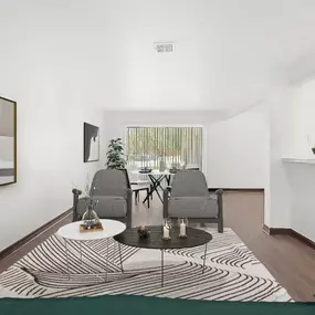 A living room with a table and chairs and a rug