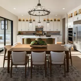 Chef's kitchens with large center islands and casual dining rooms