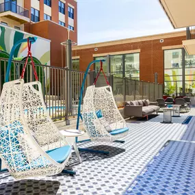 A patio with two chairs and a table.