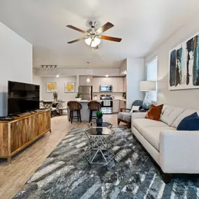The living room at The Sanctuary at 331 Apartments opens seamlessly to the dining area for easy entertaining.